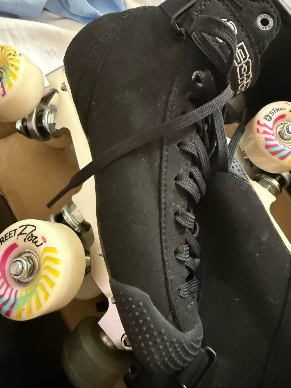 Black Suede Roller Skates with White Multi-Color Wheels